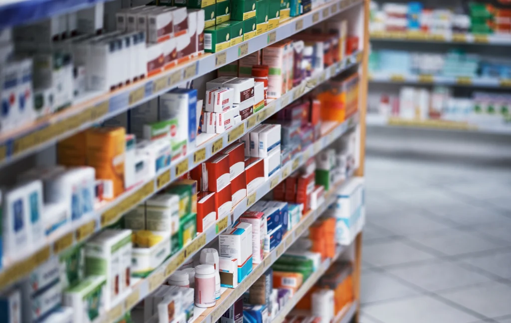 Supermarket shelves containing various medications.