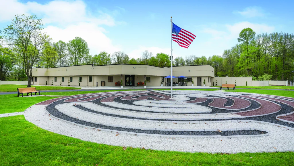 Facility with an American flag in front of it