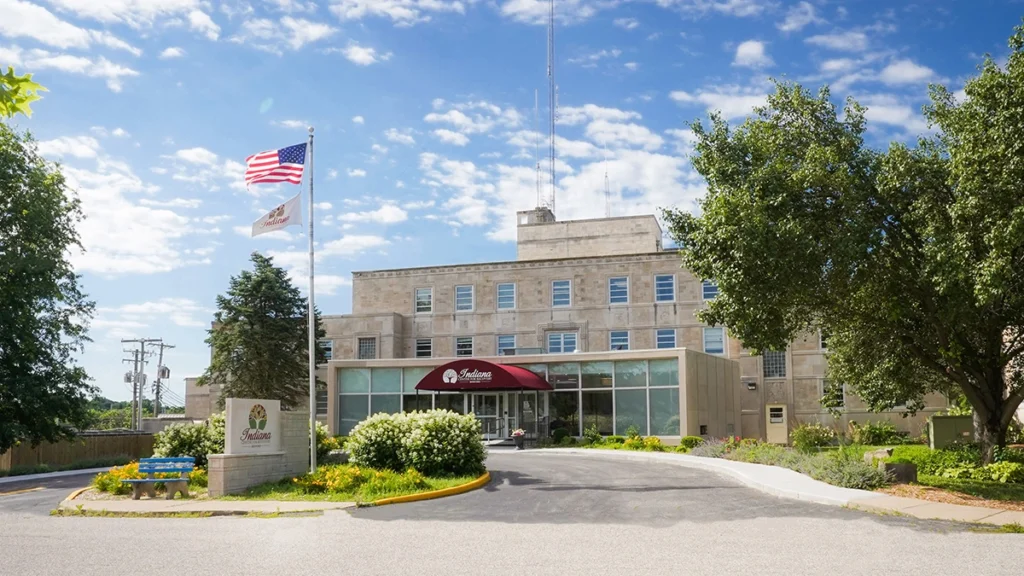 clinic on a bright sunny day with a united states flag in front